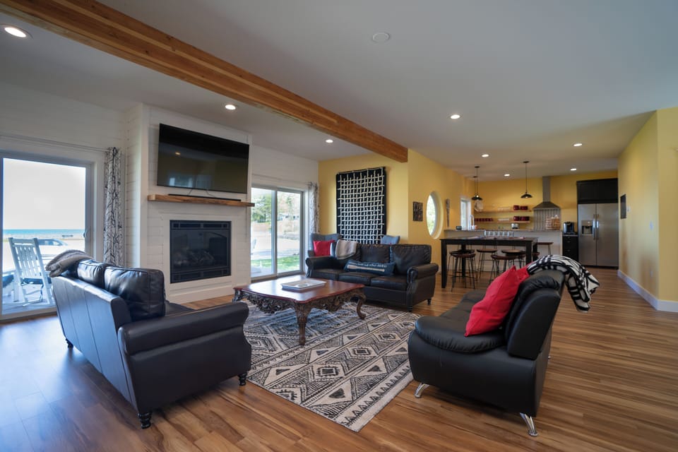Relax with views of Lake Michigan, the fireplace, and the TV