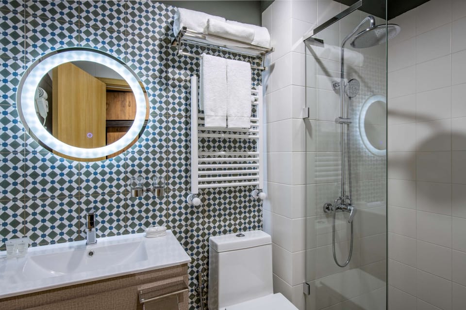 Shower, free toiletries, hair dryer, bathrobes