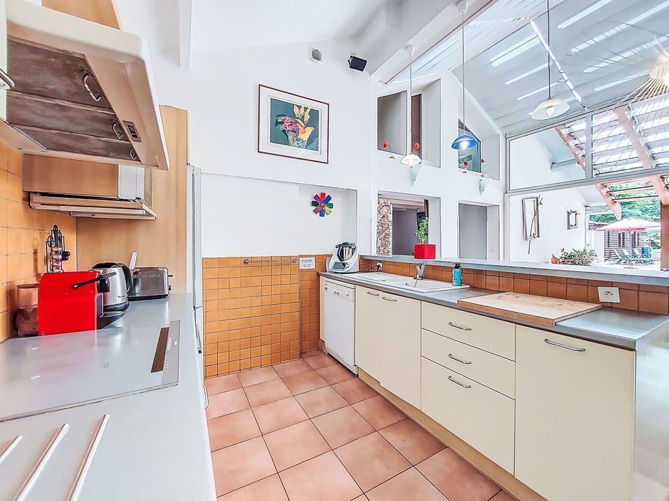 Kitchen, Countertop, Flooring, Interior Design, Wood, Ceiling, Cabinetry, Floor, Major Appliance, Kitchen Appliance