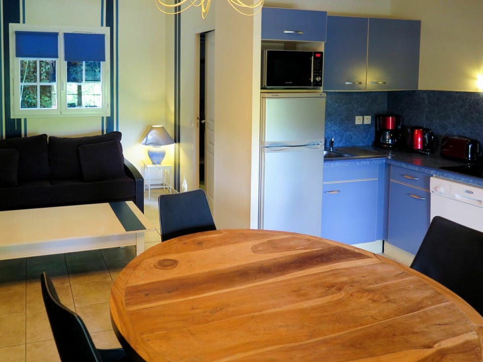 Furniture, Table, Property, Cabinetry, Countertop, Wood, Lighting, Interior Design, Drawer, Kitchen Stove