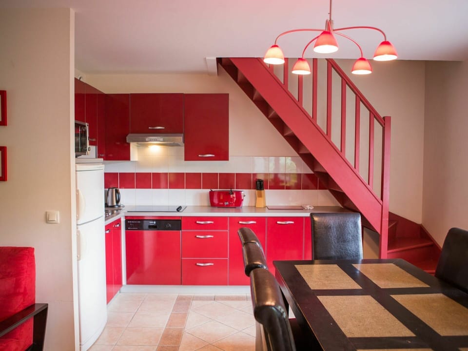 Cabinetry, Property, Countertop, Wood, Kitchen, Orange, Lighting, Flooring, Interior Design, Floor