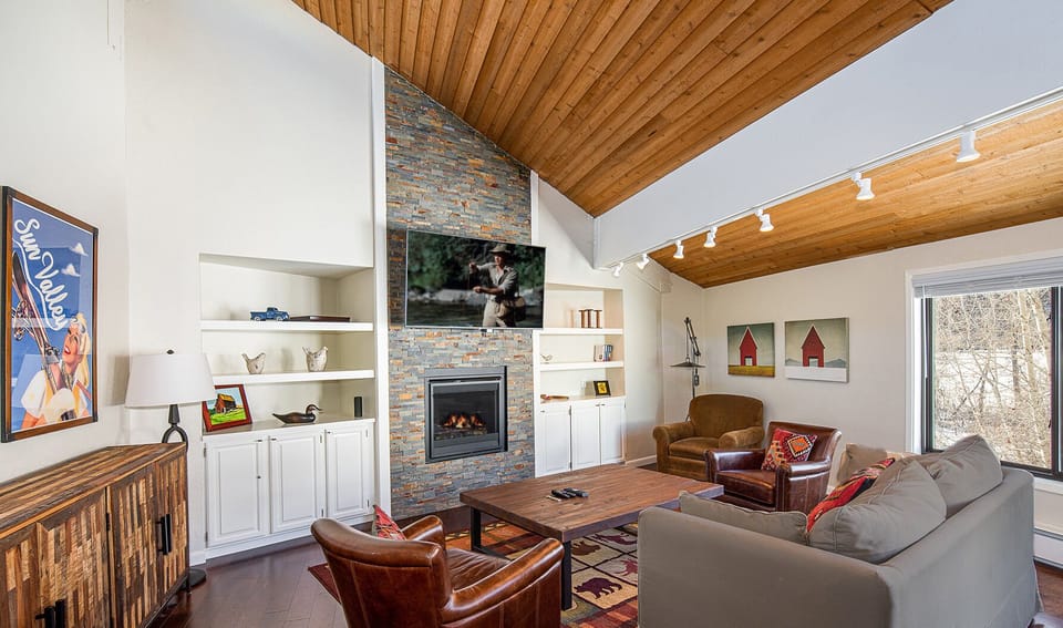 Cozy living room with fireplace and new wide screen OLED TV