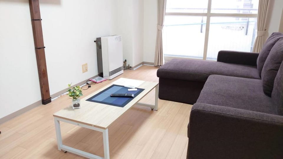1 Bedroom Apartment | Living area | Flat-screen TV