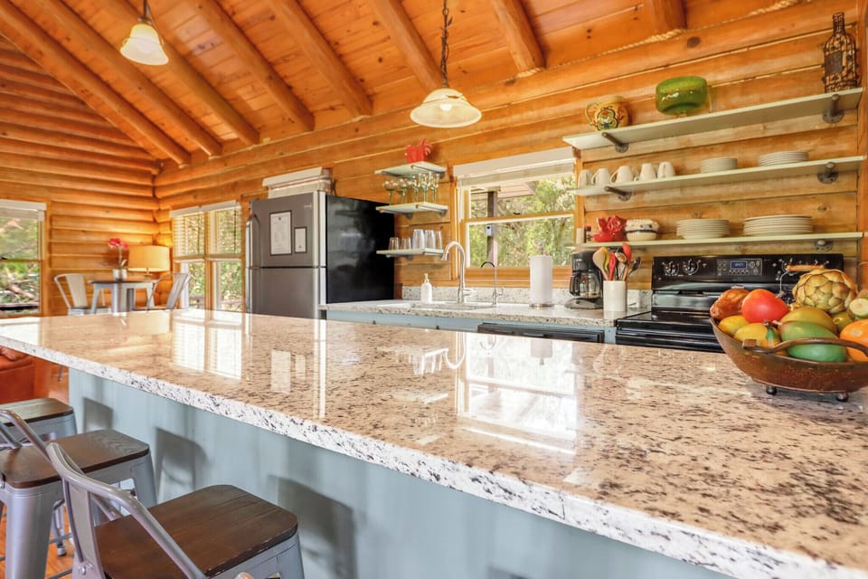 The kitchen features a spacious granite island