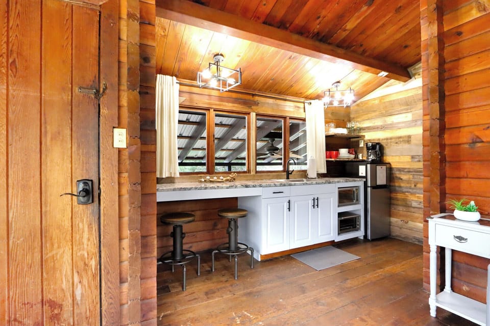 Closer view of the kitchenette showing the bar seating/dining area.