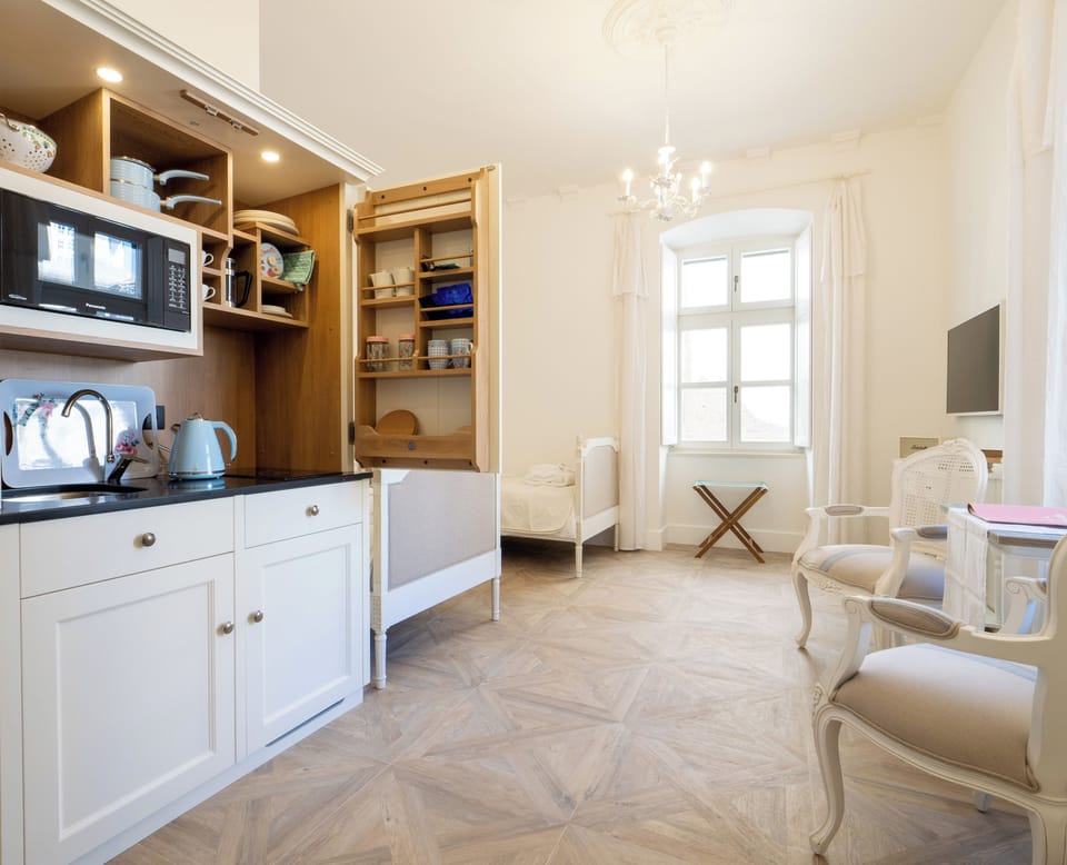 Mini-fridge, electric kettle, dining tables