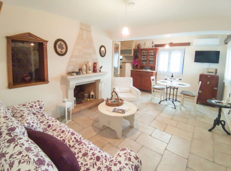 The cozy living room with a stone fireplace