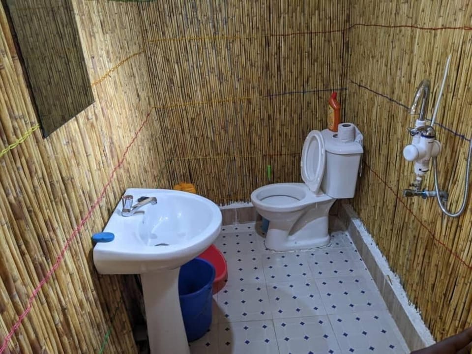Shower, slippers, towels, toilet paper