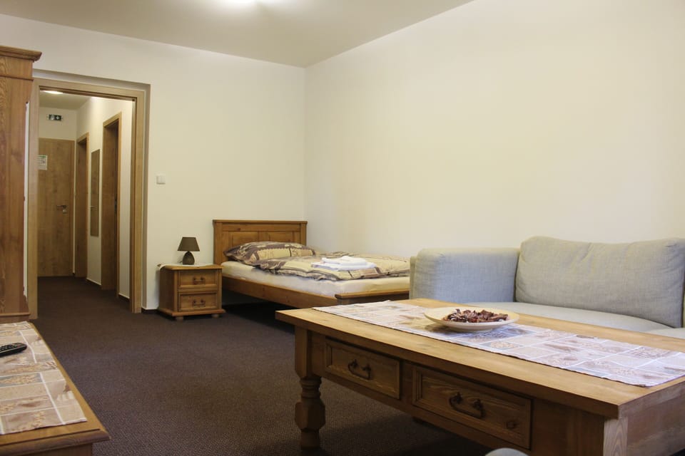Family Apartment | Living area | 57-cm flat-screen TV with cable channels, TV