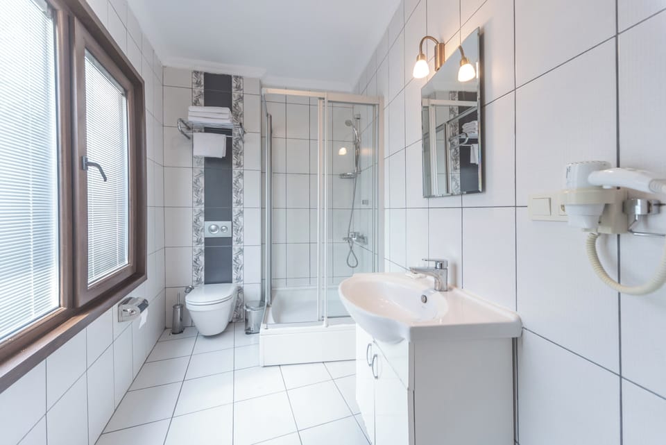 Standard Room | Bathroom | Hair dryer, slippers, towels