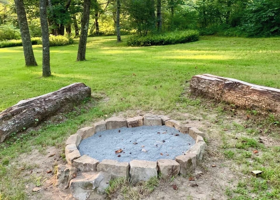 Fire pit surrounded by natural benches.