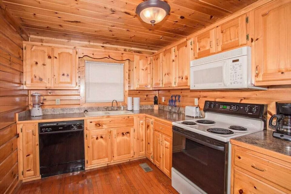 Kitchen equipped with pots, pans, dishes & utensils to help prepare meals!