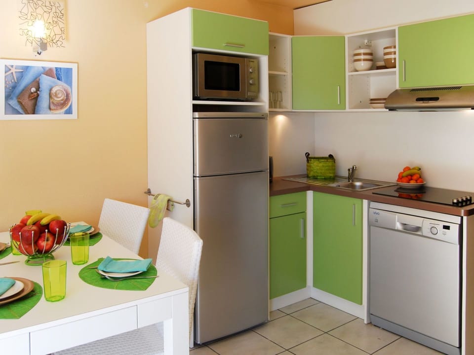 Room, Green, Kitchen, Furniture, Property, Major Appliance, Countertop, Cabinetry, Refrigerator, Yellow