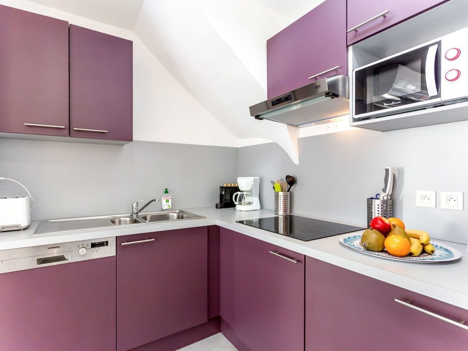 Countertop, Kitchen, Cabinetry, Room, Property, Violet, Furniture, Yellow, Purple, Interior Design