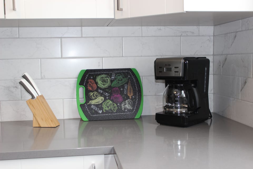 Quartz countertop and tile backsplash