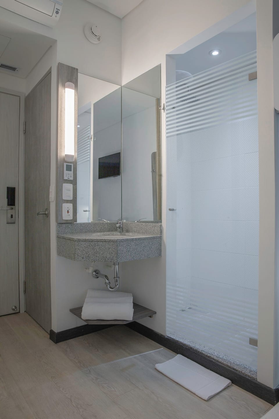 Shower, rainfall showerhead, eco-friendly toiletries, towels