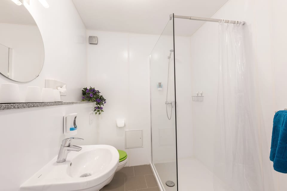 Apartment, 1 Bedroom | Bathroom | Shower, free toiletries, hair dryer, heated floors
