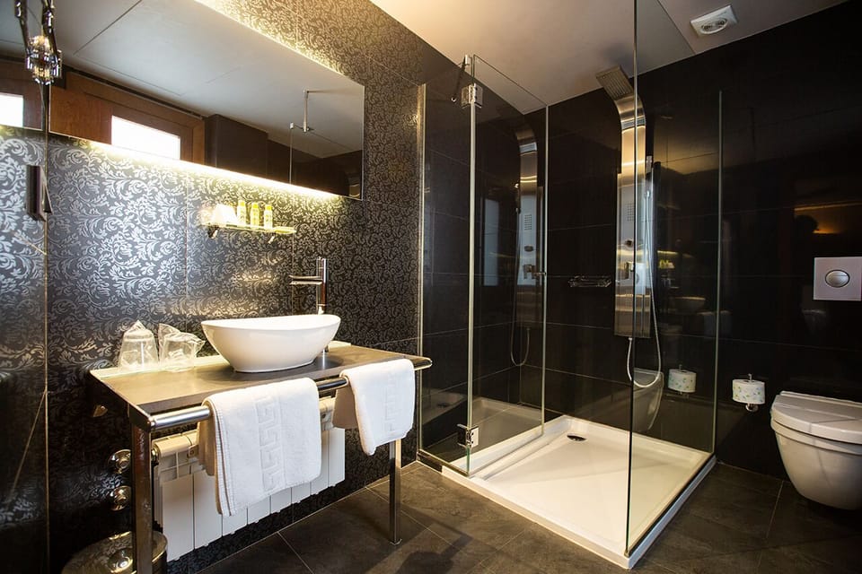 Eco-friendly toiletries, hair dryer, bidet, towels