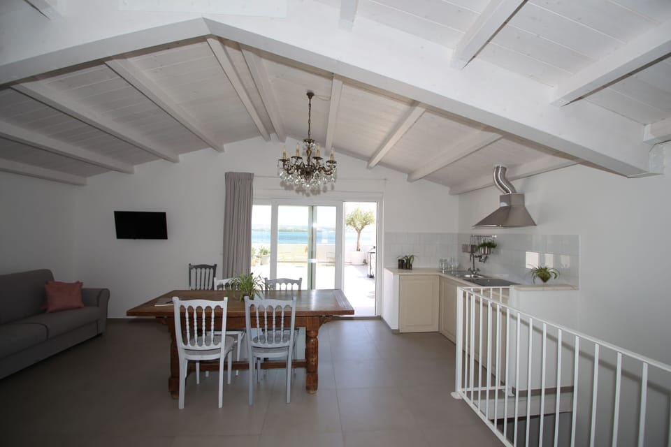 Deluxe Suite, Sea View | Living area | Flat-screen TV