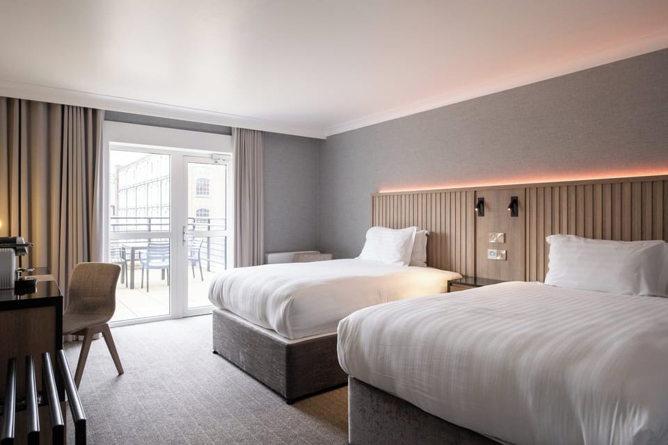 Deluxe Suite, 2 Double Beds, Balcony (Quay View) | In-room safe, desk, laptop workspace, soundproofing