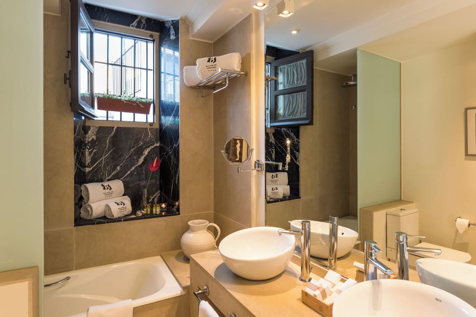 Family Triple Room | Bathroom | Rainfall showerhead, designer toiletries, hair dryer, bathrobes