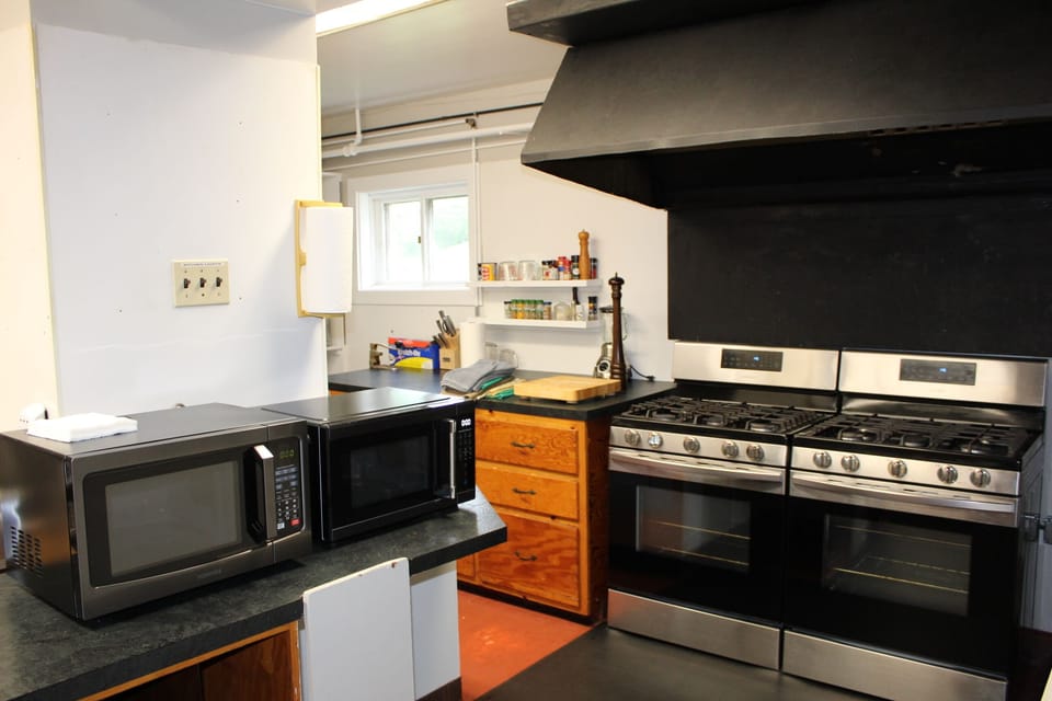 Kitchen - with 2 of most appliances. Gas ranges, microwaves, drip coffee makers.
