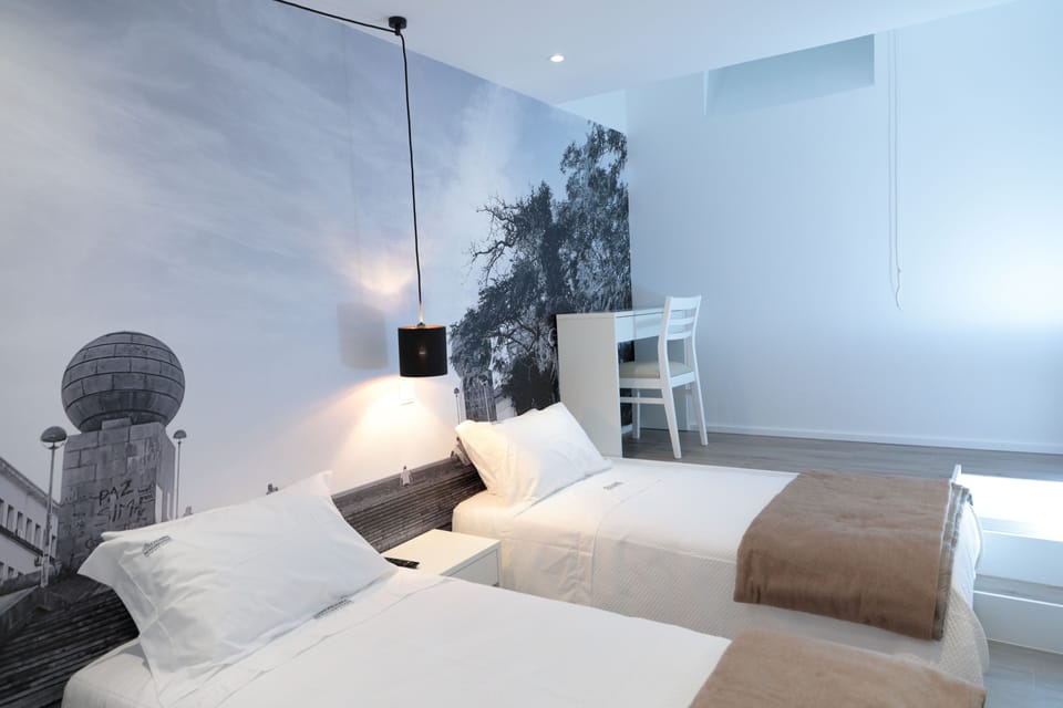 Twin Room | Desk, laptop workspace, blackout drapes, iron/ironing board