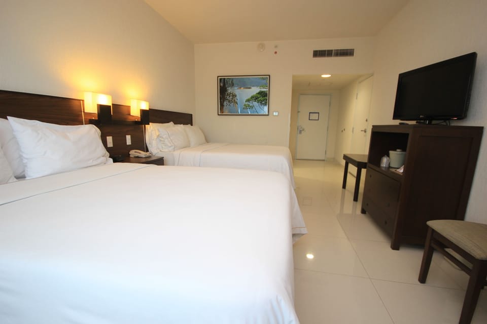 Standard Room, 2 Double Beds | Down comforters, in-room safe, desk, blackout drapes