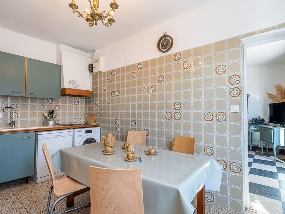 Flooring, Interior Design, Kitchen, Floor, Countertop, Major Appliance, Room, Cabinetry, Ceiling, Kitchen Appliance