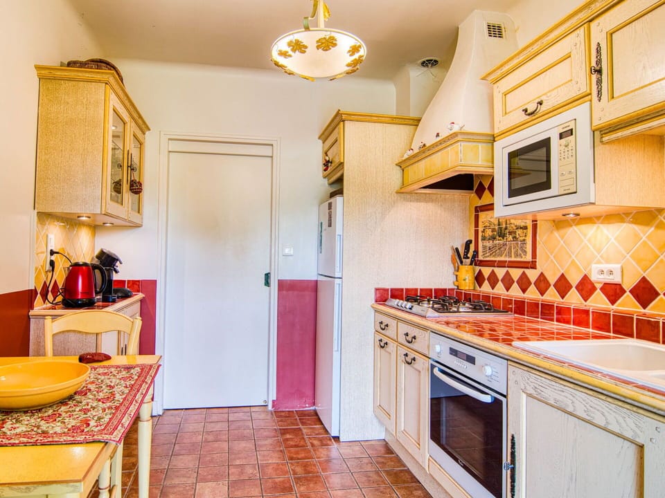 Kitchen, Major Appliance, Interior Design, Flooring, Countertop, Kitchen Appliance, Yellow, Kitchen Stove, Floor, Furniture