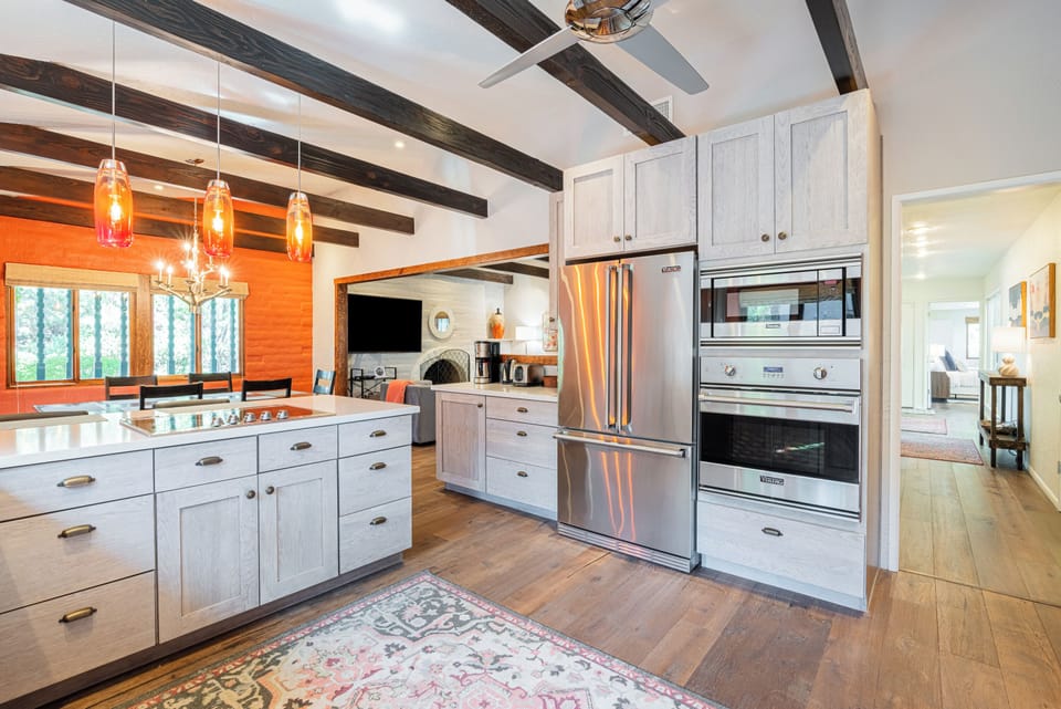 Fully Equipped Kitchen with Stone Countertops and Stainless Appliances