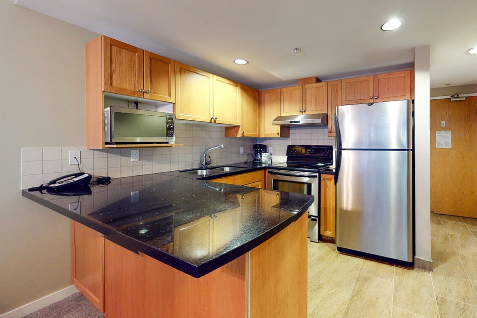 Condo | Private kitchen | Full-size fridge, microwave, oven, stovetop