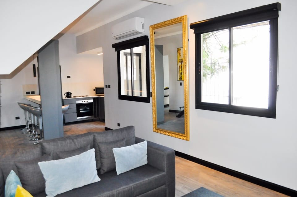 Our Casa Soho Living Room, Dining and Kitchen with plenty of natural light.