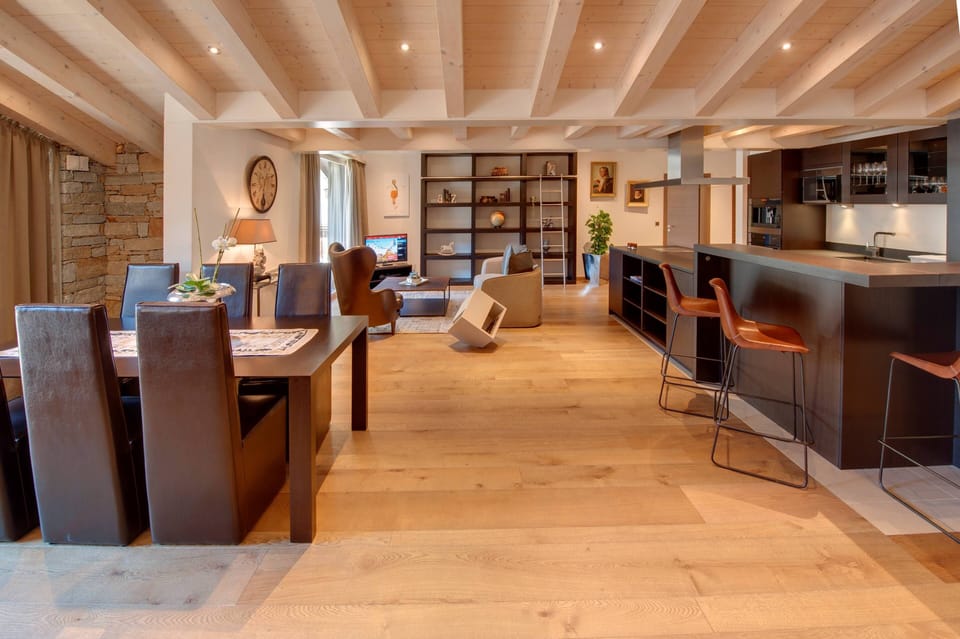 Penthouse | Living area | 70-cm flat-screen TV with cable channels, TV, heated floors