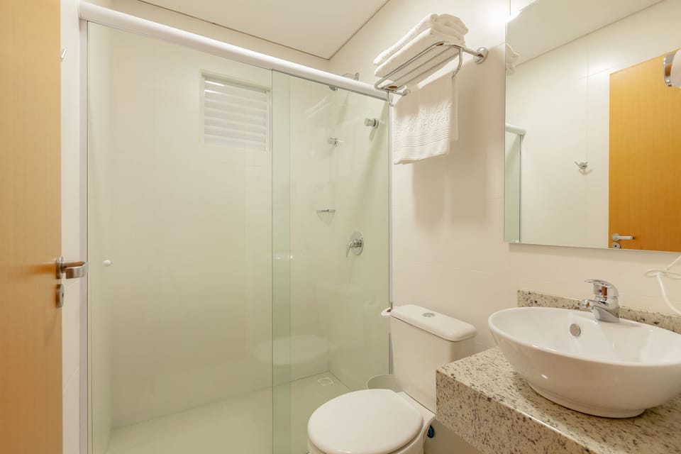 Shower, rainfall showerhead, designer toiletries, hair dryer