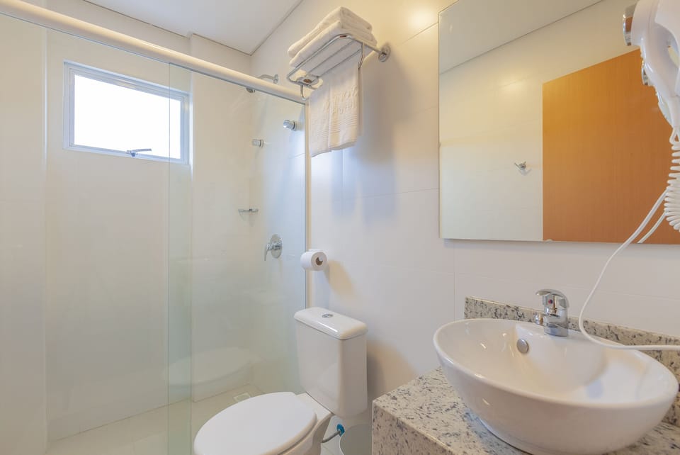 Shower, rainfall showerhead, designer toiletries, hair dryer
