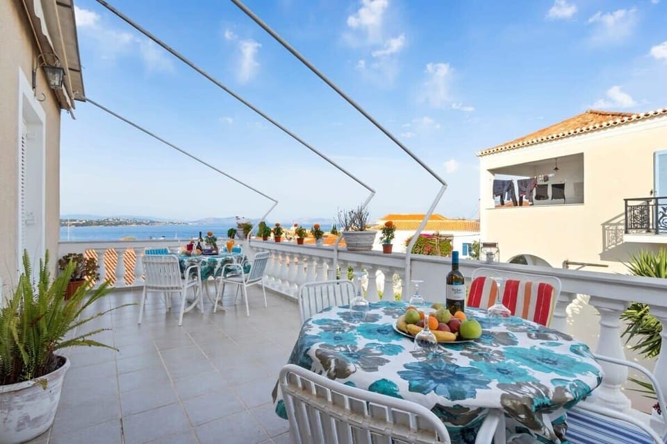 Shared Balcony with Outdoor Dining Area and Scenic Open Views