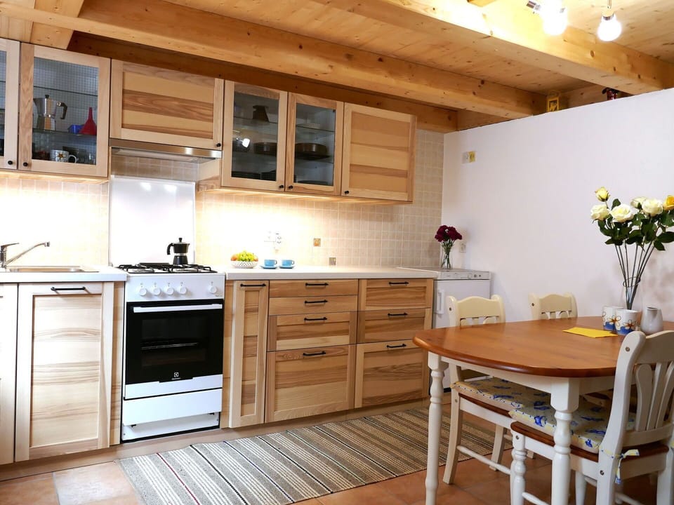 Furniture, Kitchen, Flooring, Cabinetry, Interior Design, Wood, Countertop, Kitchen Appliance, Floor, Major Appliance