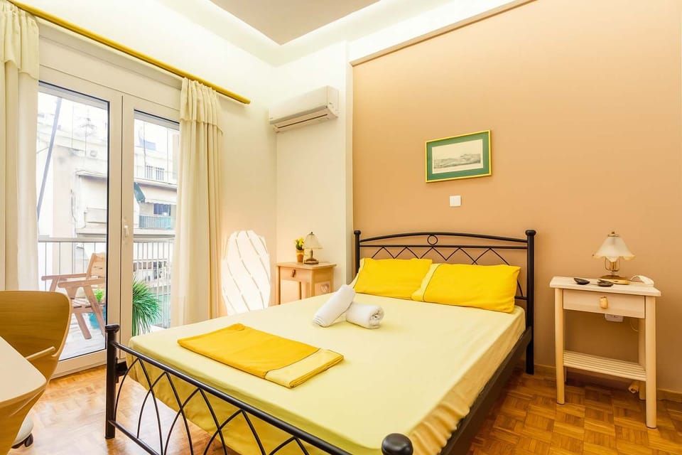 Bedroom 1: Sunny Double Bed with Balcony View
Peaceful and bright, this bedroom offers a comfortable double bed, direct access to the balcony, and cheerful decorative touches.