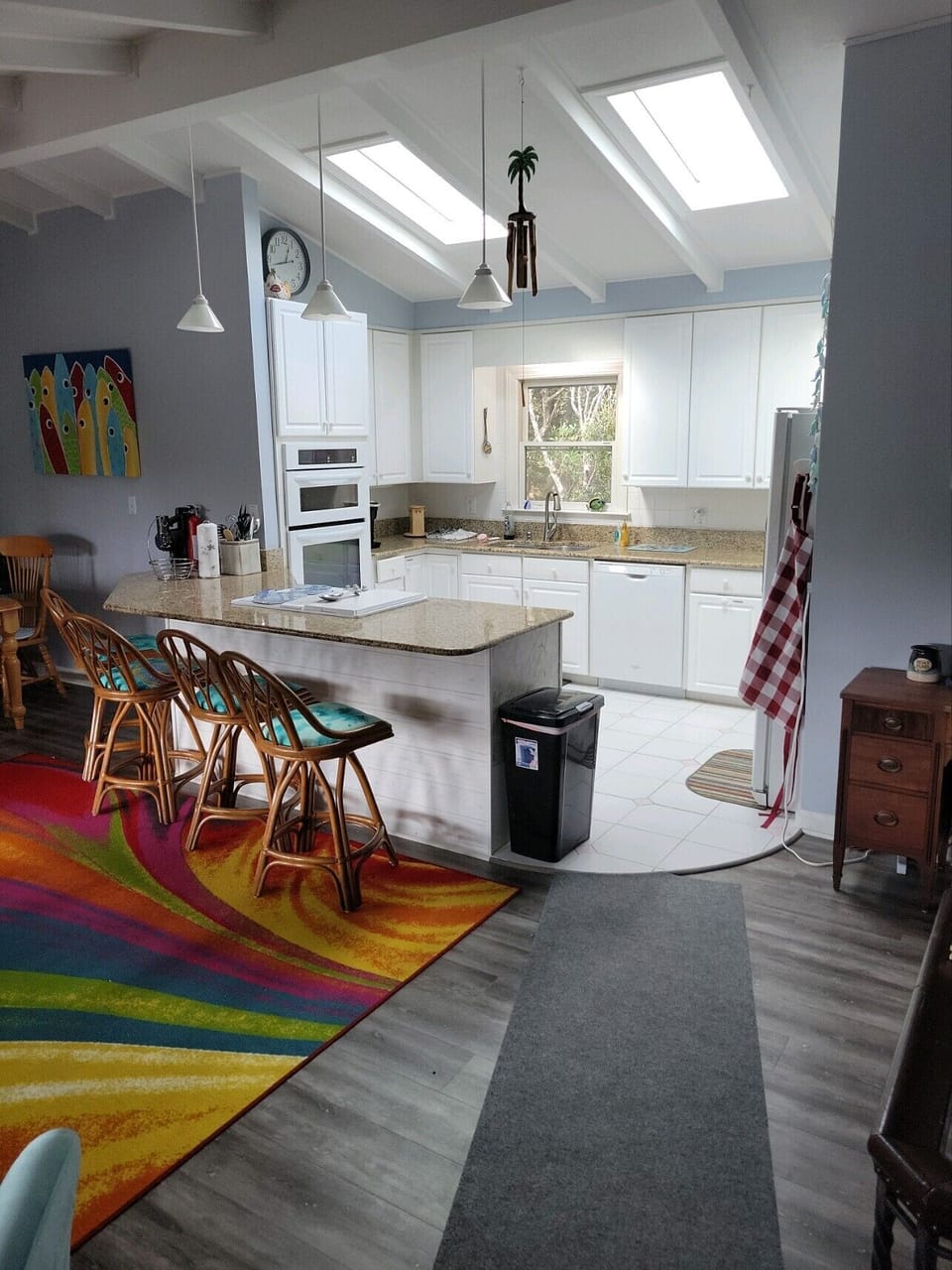 Large kitchen area with breakfast bar.