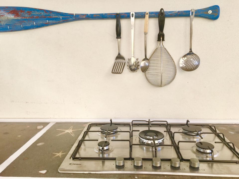 Fridge, stovetop, espresso maker, coffee/tea maker