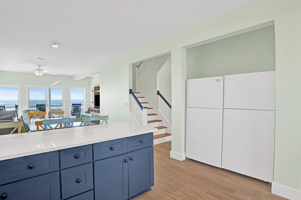 Featuring stone counters and dual refrigerators