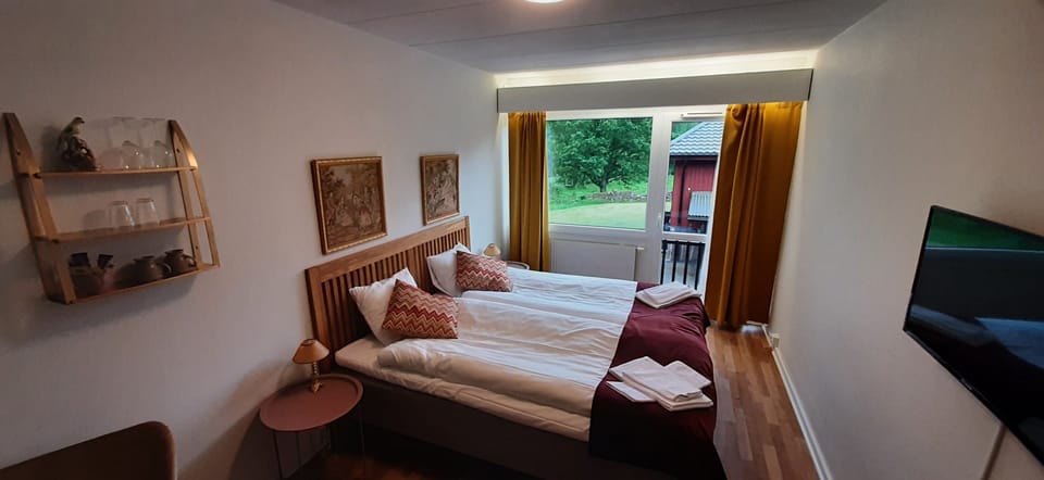 Double Room, Garden View | Blackout drapes, soundproofing, iron/ironing board, free WiFi