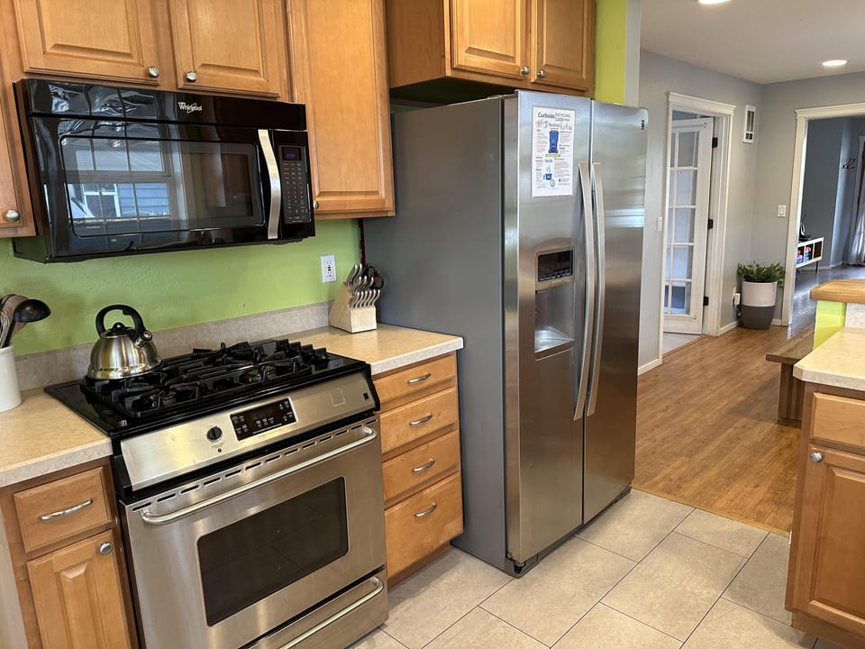 Fully furnished kitchen with pots, pan and dishes for your stay