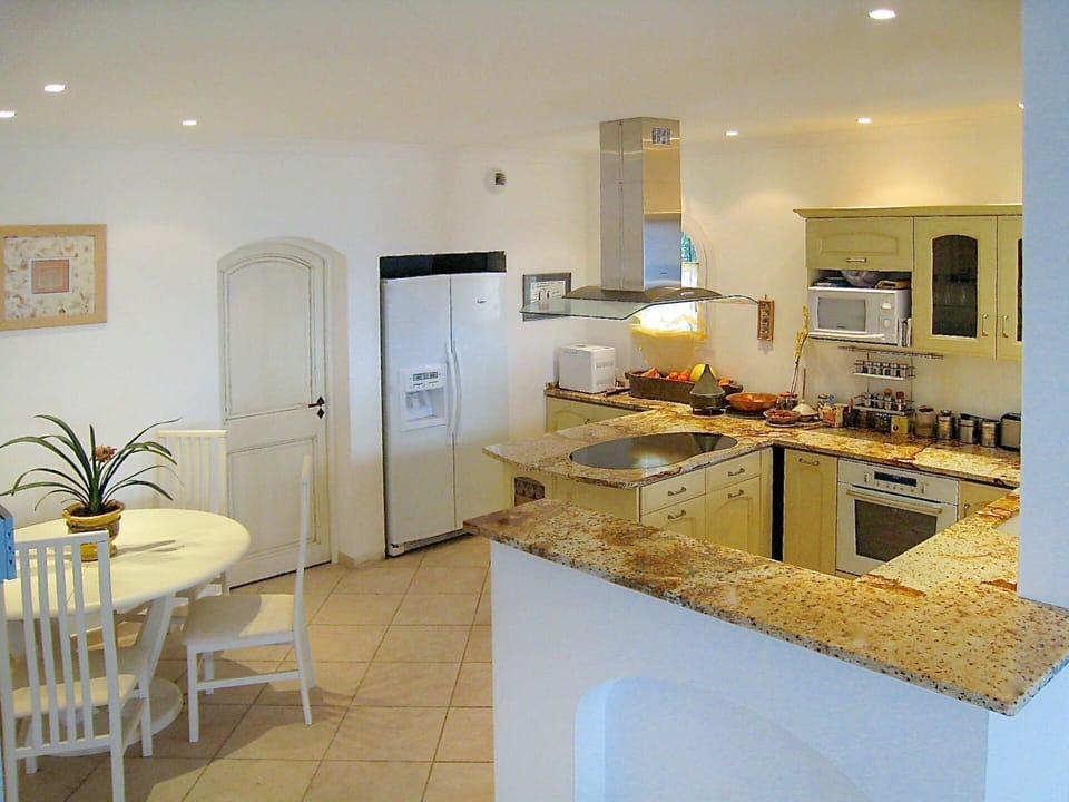 Countertop, Room, Property, Interior Design, Furniture, Kitchen, Building, Yellow, Ceiling, Floor