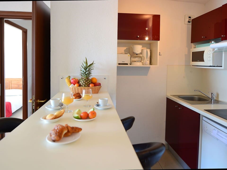 Furniture, Table, Property, Cabinetry, Food, Tableware, Dishware, Plant, Building, Chair