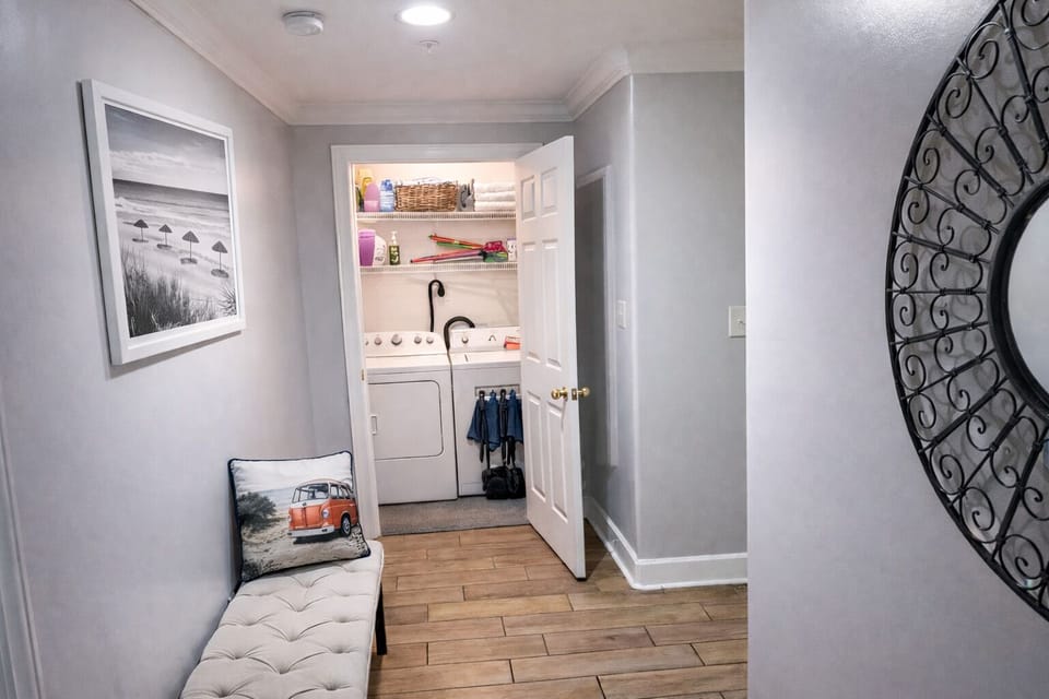 Laundry room with beach toys and wagon