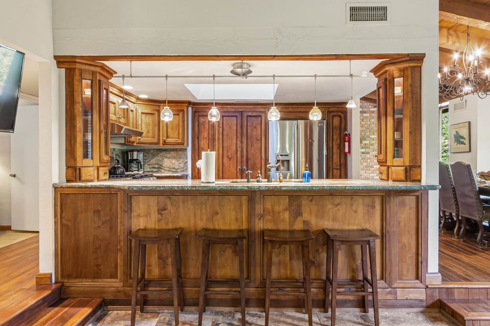 Fully Equipped Kitchen with a Large Granite Counter Island