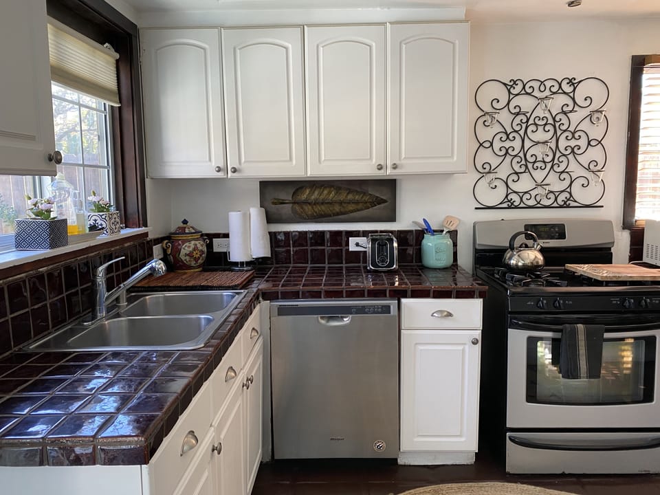 Full kitchen - utensils pots and pans - dishes - microwave - dishwasher 