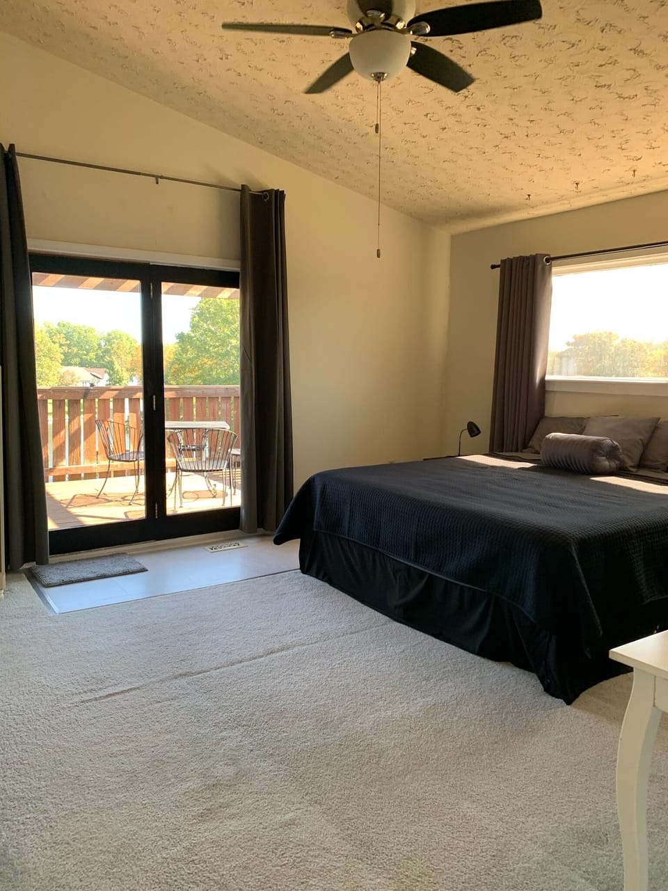 Master Bedroom w/ King Bed, walk-out deck, and stunning views, third floor.